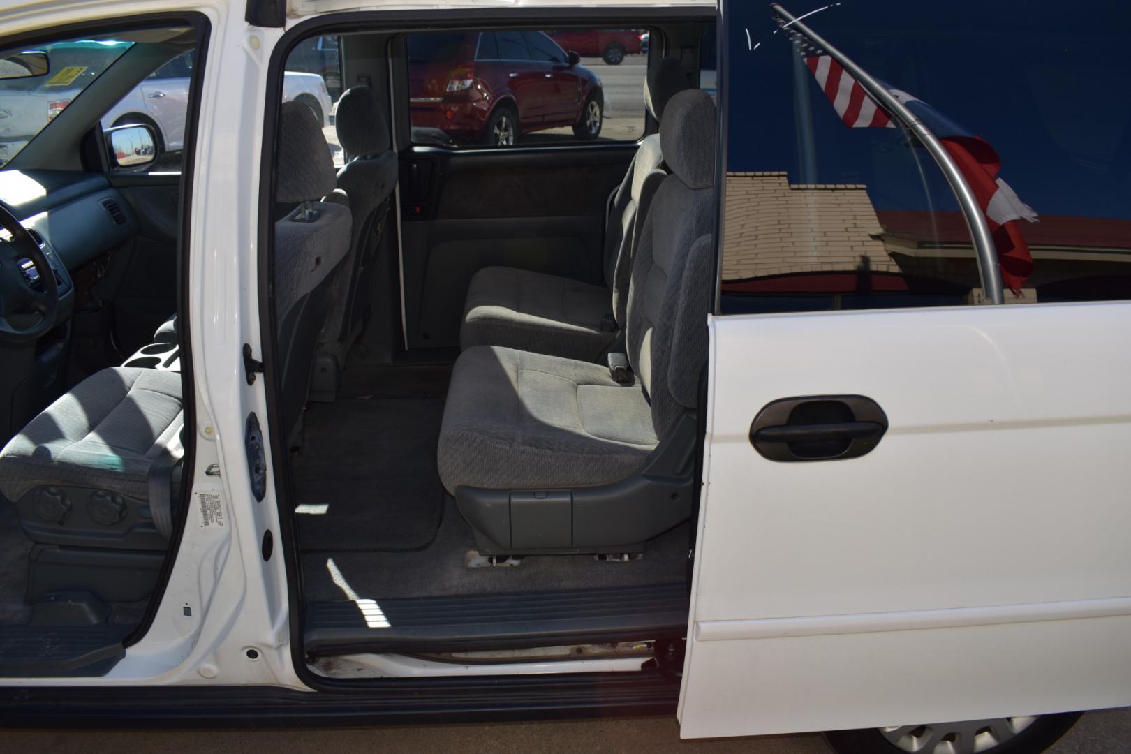 2003 White /Gray Honda Odyssey (5FNRL18513B) , located at 5925 E. BELKNAP ST., HALTOM CITY, TX, 76117, (817) 834-4222, 32.803799, -97.259003 - Buying a 2003 Honda Odyssey can be a smart choice for several reasons: Reliability: Hondas are known for their reliability, and the Odyssey is no exception. The 2003 model year is often praised for its durability and long-lasting performance. Safety: The 2003 Honda Odyssey comes equipped with safe - Photo#19